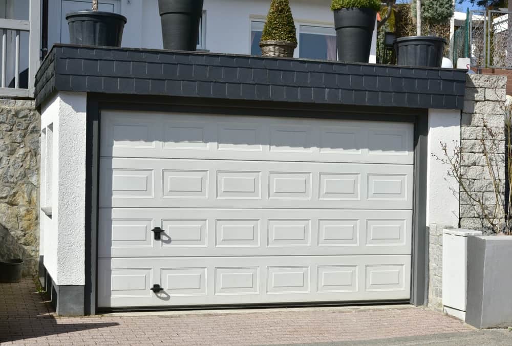 How Much Does A Garage Door Cost? (Cost Guides & Saving Tips)