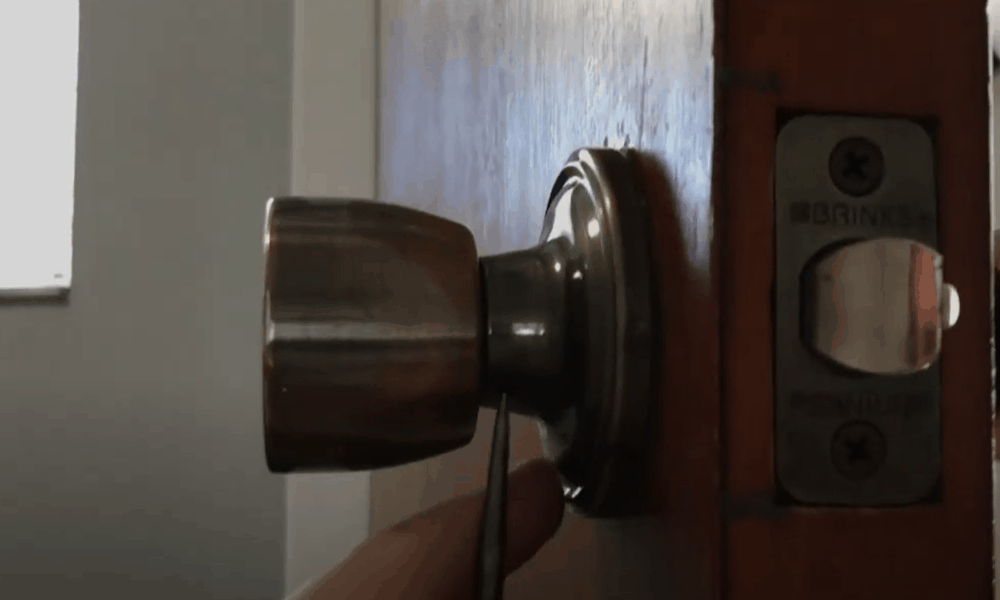 Determine if the recessed lock system is held in place by a screw or detent