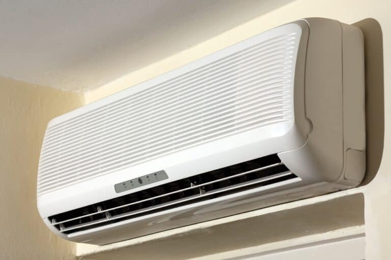 Air Conditioner Running But Not Lowering Temperature (Causes & Solutions)