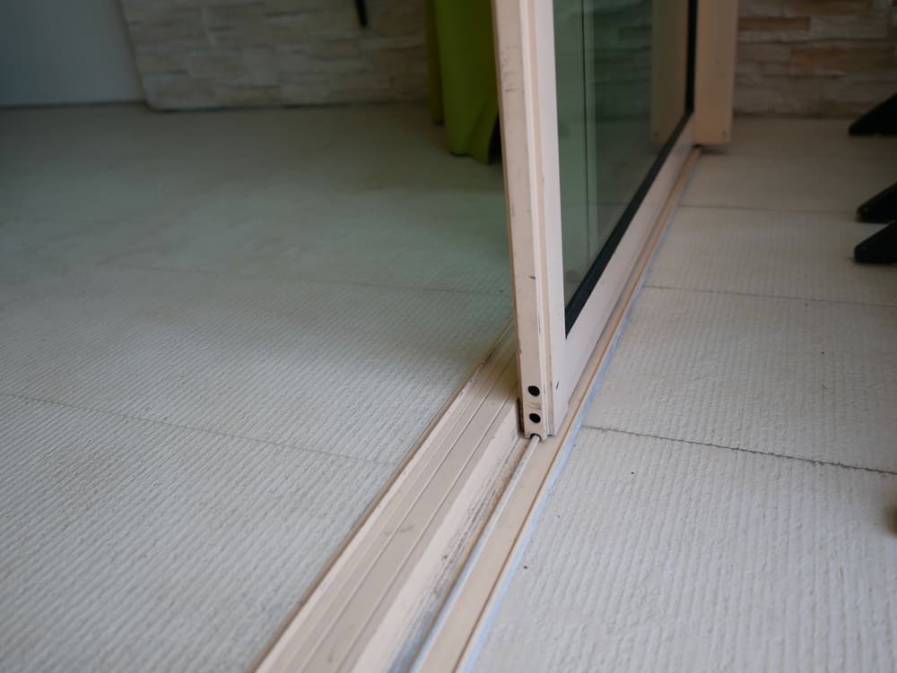 how to prevent water intrusion on sliding glass doors