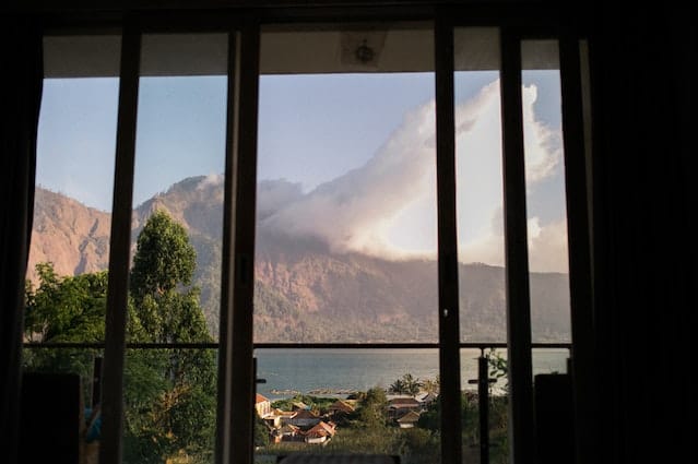 Cloudy mountains as seen from the inside through a window